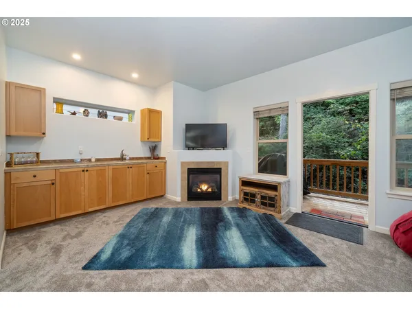 a kitchen with a sink and a stove top oven