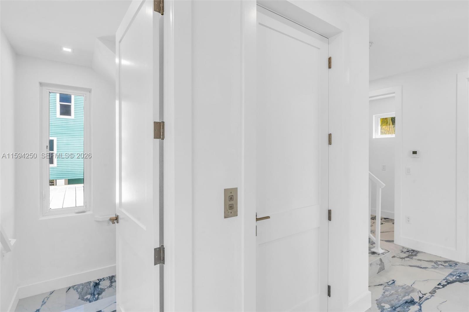 84 Coral Way Key Largo, FL 33037 - Photo 18 of 55 a view of a hallway with two rooms