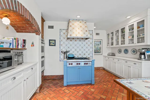 a kitchen with stainless steel appliances granite countertop a stove and a cabinets