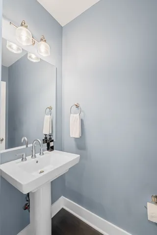 a bathroom with a sink a mirror and vanity