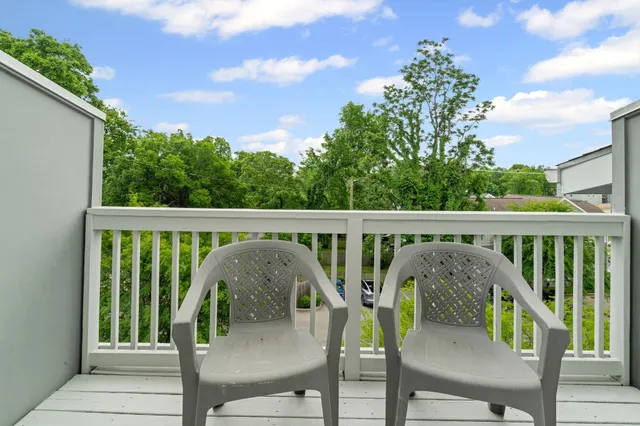 a view of balcony and outdoor seating