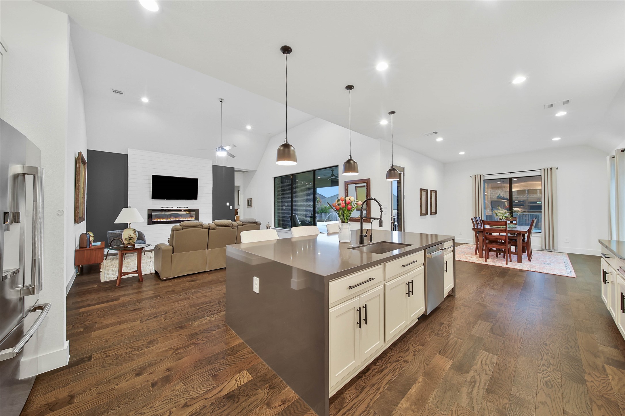 1015 Oak Briar Lane Conroe, TX 77384 - Photo 18 of 50 a large kitchen with stainless steel appliances kitchen island granite countertop a large island in the center