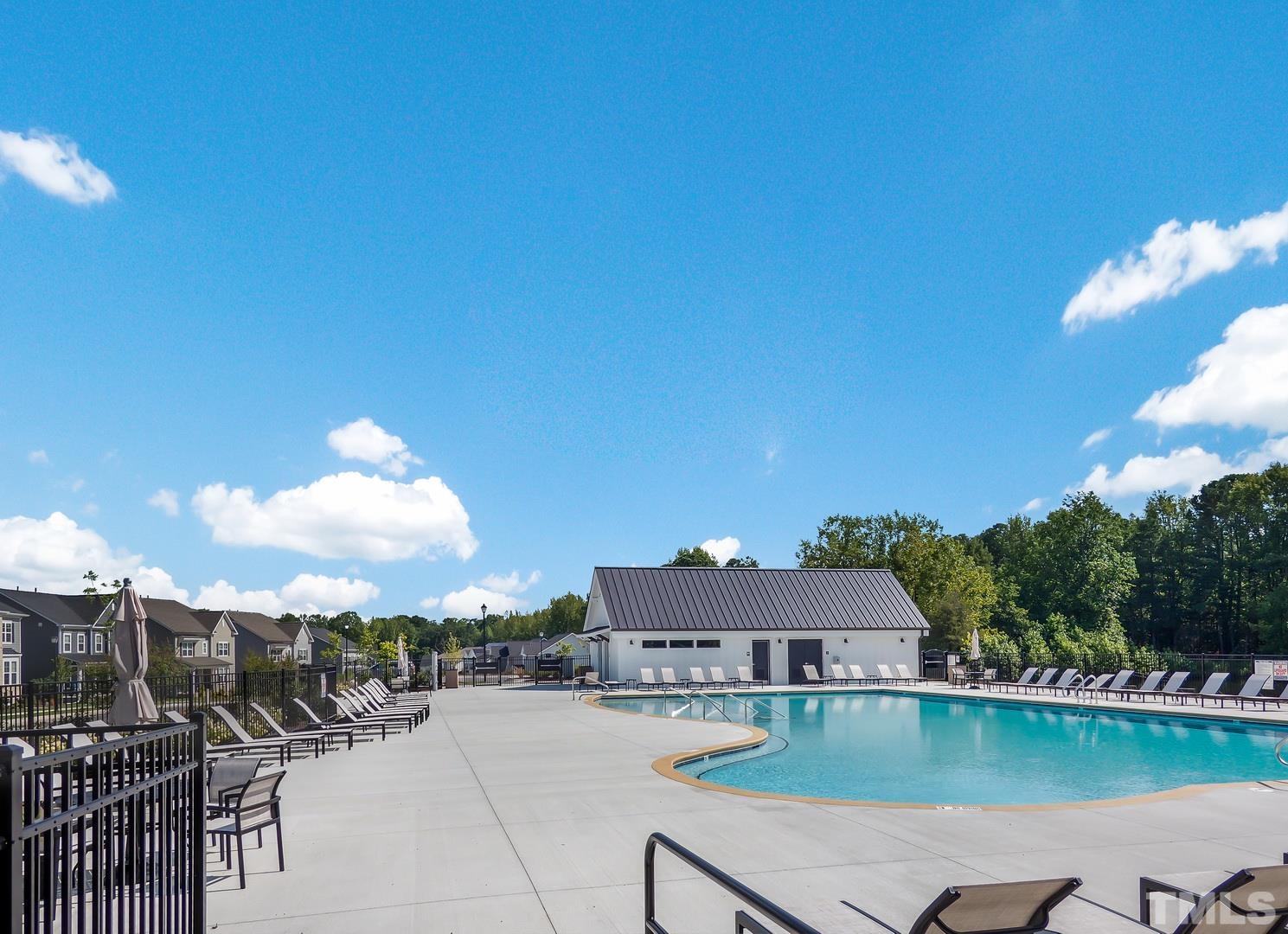 2997 Rise And Shine Road, Unit 559 WALKER A Apex, NC 27502 - Photo 14 of 14 a view of a swimming pool with a patio