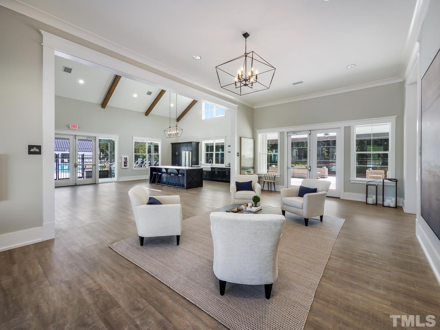 2997 Rise And Shine Road, Unit 559 WALKER A Apex, NC 27502 - Photo 5 of 14 a living room with furniture or chandelier and a wooden floor