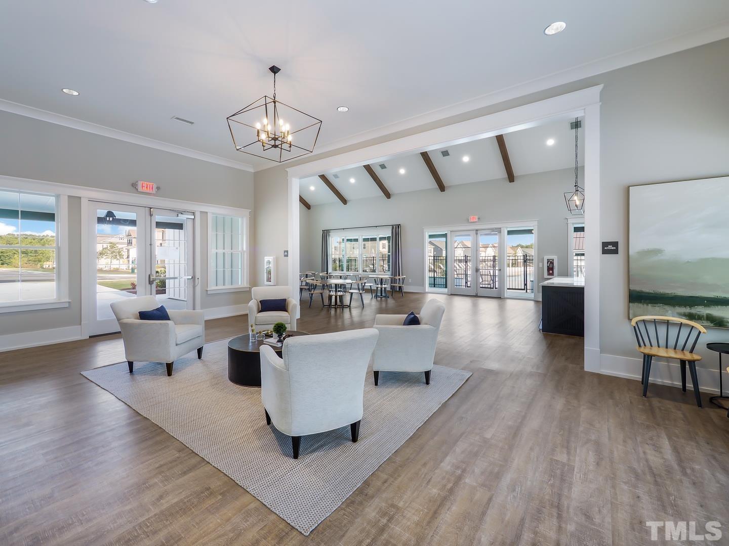 2997 Rise And Shine Road, Unit 559 WALKER A Apex, NC 27502 - Photo 6 of 14 a living room with lots of furniture and wooden floor
