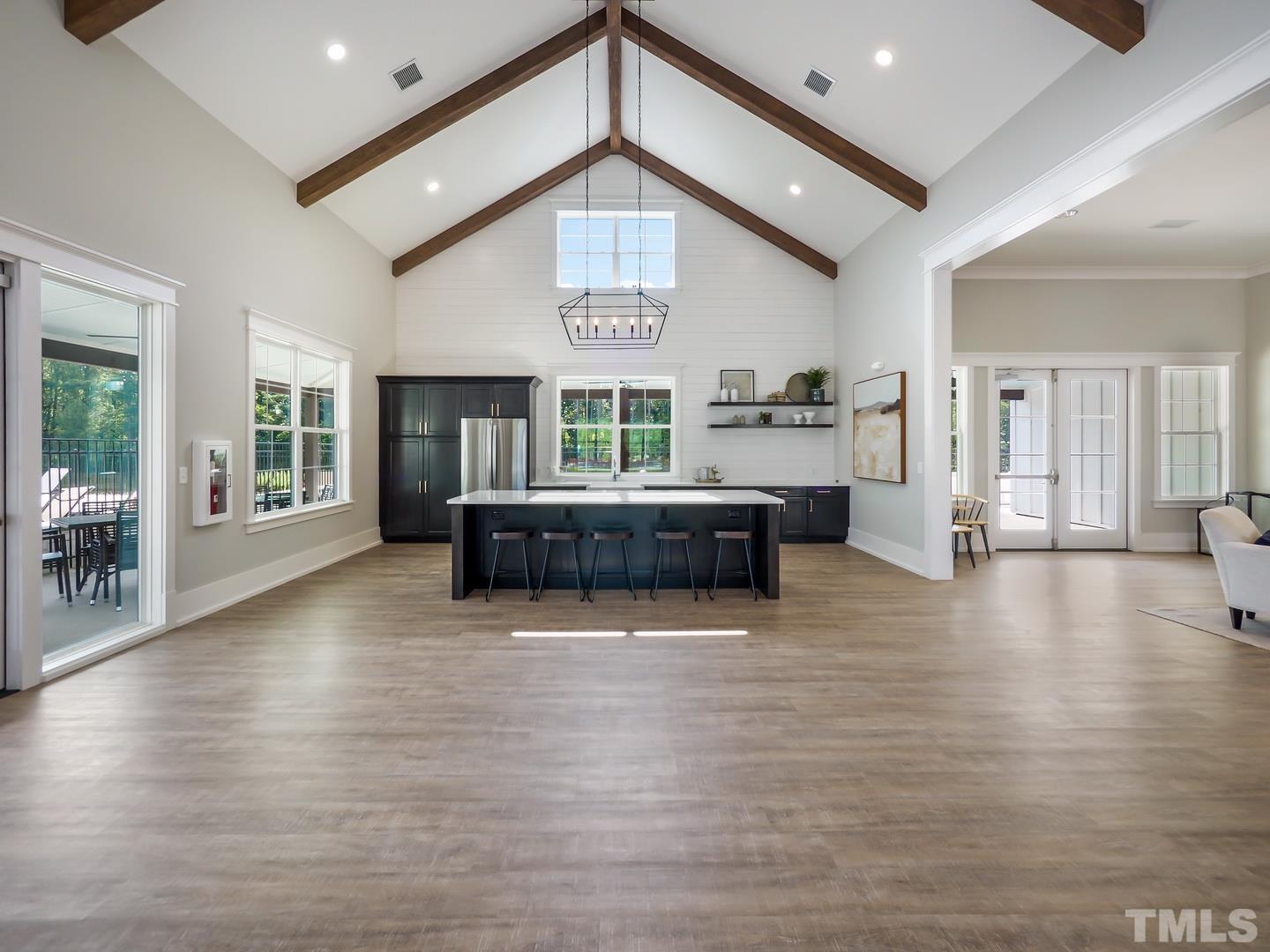 2997 Rise And Shine Road, Unit 559 WALKER A Apex, NC 27502 - Photo 7 of 14 a living room with fireplace furniture and a wooden floor