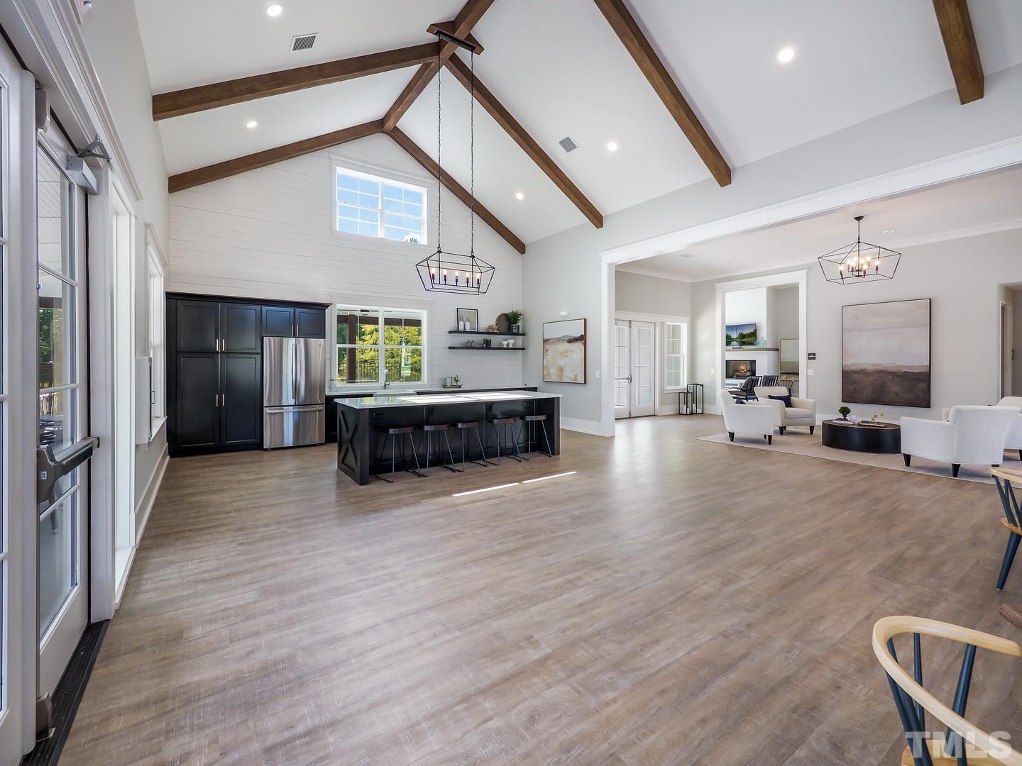 2997 Rise And Shine Road, Unit 559 WALKER A Apex, NC 27502 - Photo 8 of 14 a living room with furniture and a wooden floor