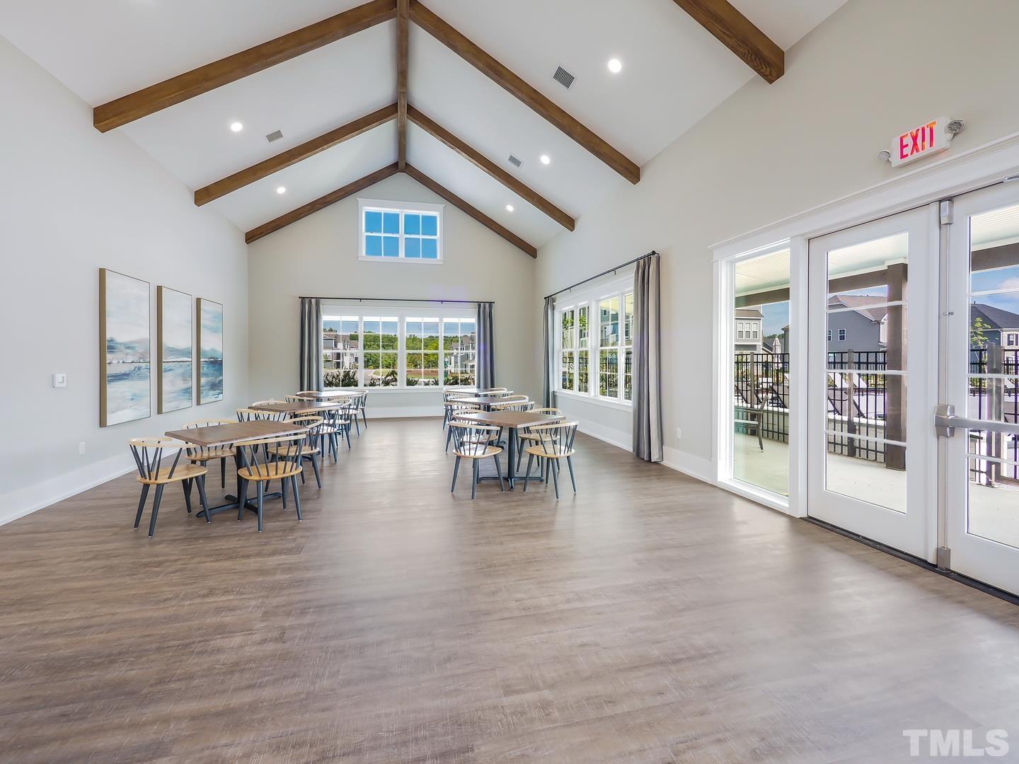 2997 Rise And Shine Road, Unit 559 WALKER A Apex, NC 27502 - Photo 9 of 14 a dining room with furniture and wooden floor