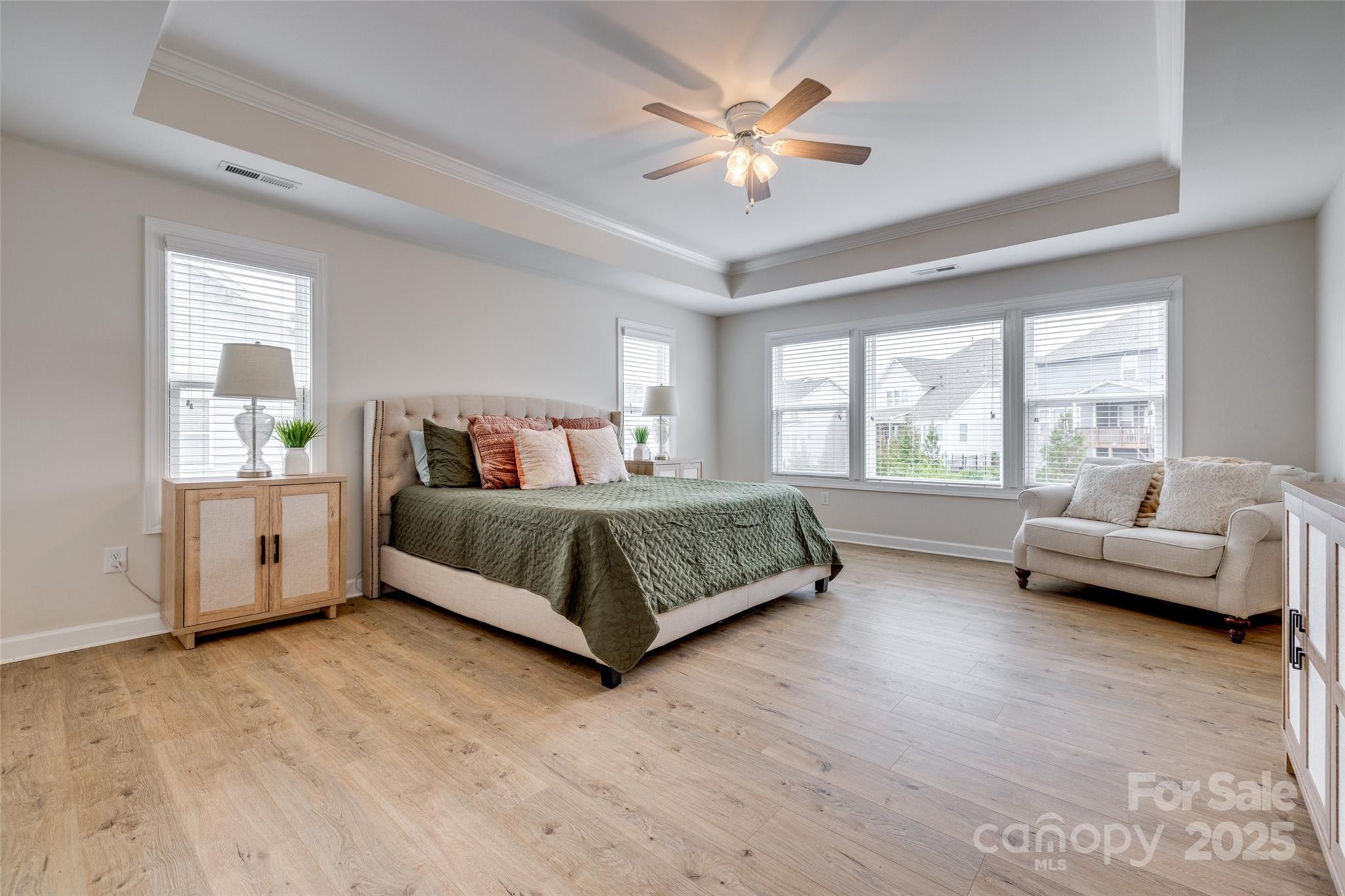 5431 Meadowcroft Way Fort Mill, SC 29708 - Photo 22 of 40 a bedroom with a bed and a couch