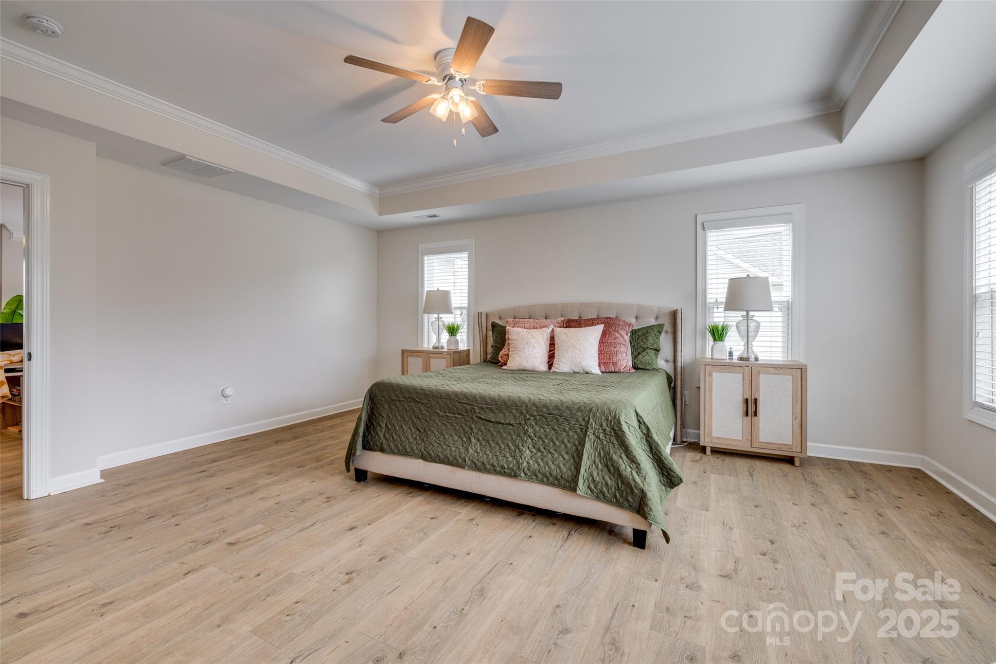 5431 Meadowcroft Way Fort Mill, SC 29708 - Photo 23 of 40 a bedroom with a bed and a chandelier