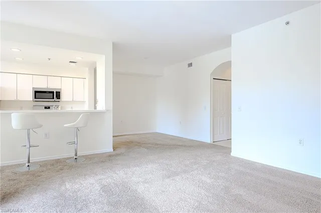 a view of a kitchen with electric appliances