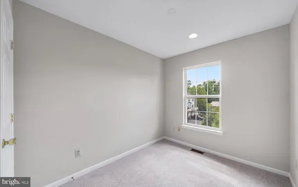 a bathroom with a bathtub and toilet