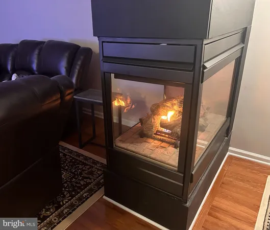 a kitchen with stainless steel appliances granite countertop a stove a sink dishwasher a microwave oven and a refrigerator