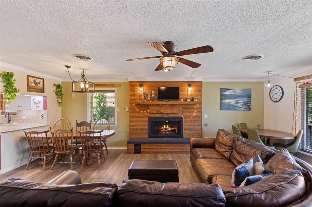 227 Scenic Road Trinidad, TX 75163 - Photo 14 of 40 a living room with furniture and a fireplace
