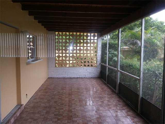 5521 Buchanan Street Hollywood, FL 33021 - Photo 11 of 12 a view of empty room with windows