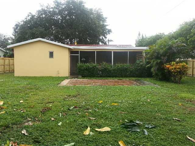 5521 Buchanan Street Hollywood, FL 33021 - Photo 2 of 12 a view of a house with a yard