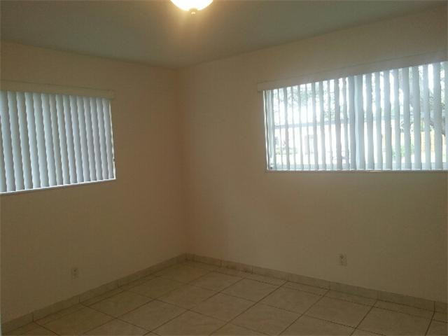 5521 Buchanan Street Hollywood, FL 33021 - Photo 6 of 12 an empty room with a window