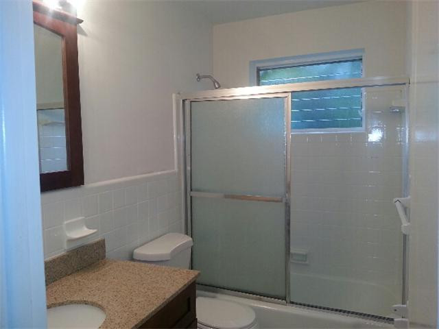 5521 Buchanan Street Hollywood, FL 33021 - Photo 8 of 12 a bathroom with a toilet and a shower