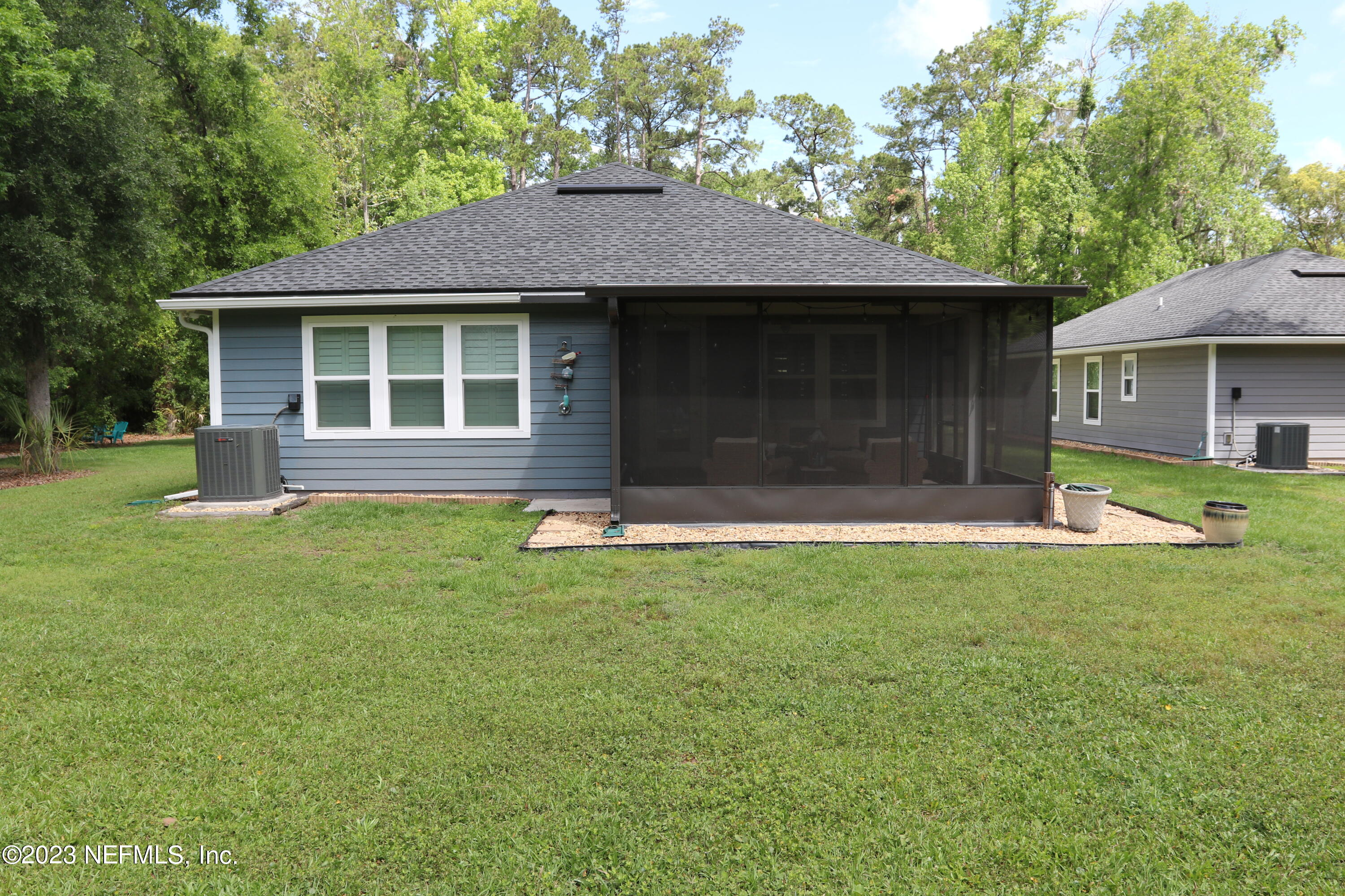 3836 Collins Road Jacksonville, FL 32244 - Photo 12 of 40 a front view of a house with a yard