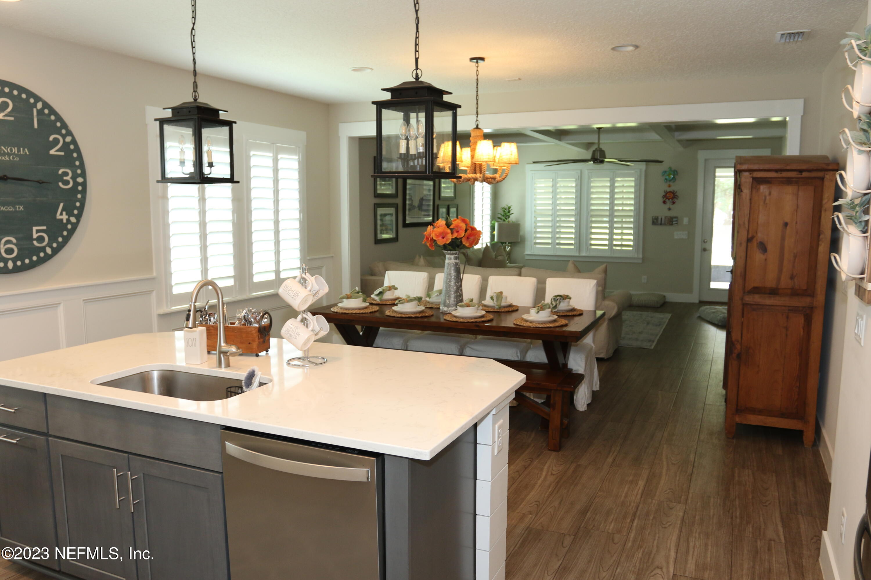 3836 Collins Road Jacksonville, FL 32244 - Photo 17 of 40 a kitchen with sink refrigerator and window