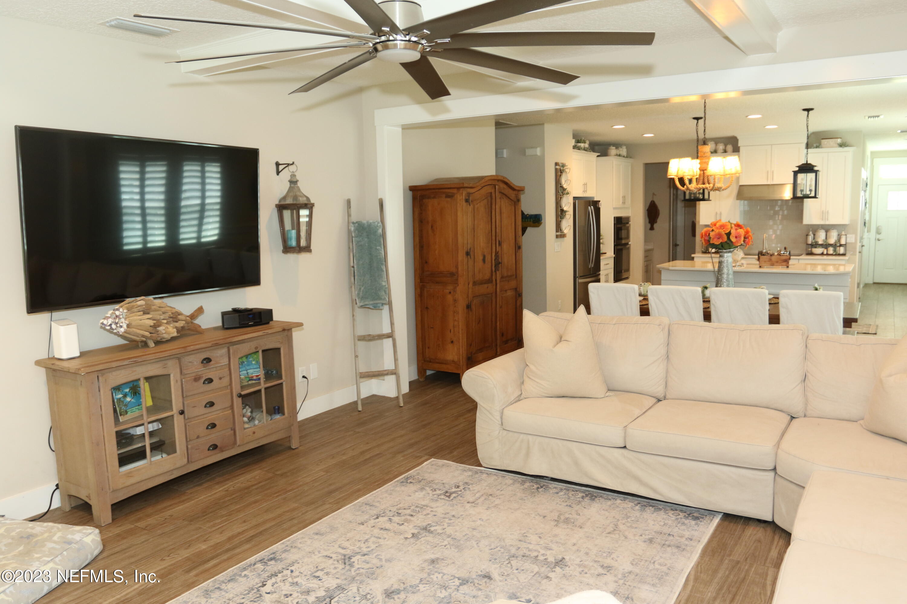 3836 Collins Road Jacksonville, FL 32244 - Photo 21 of 40 a living room with furniture and a flat screen tv
