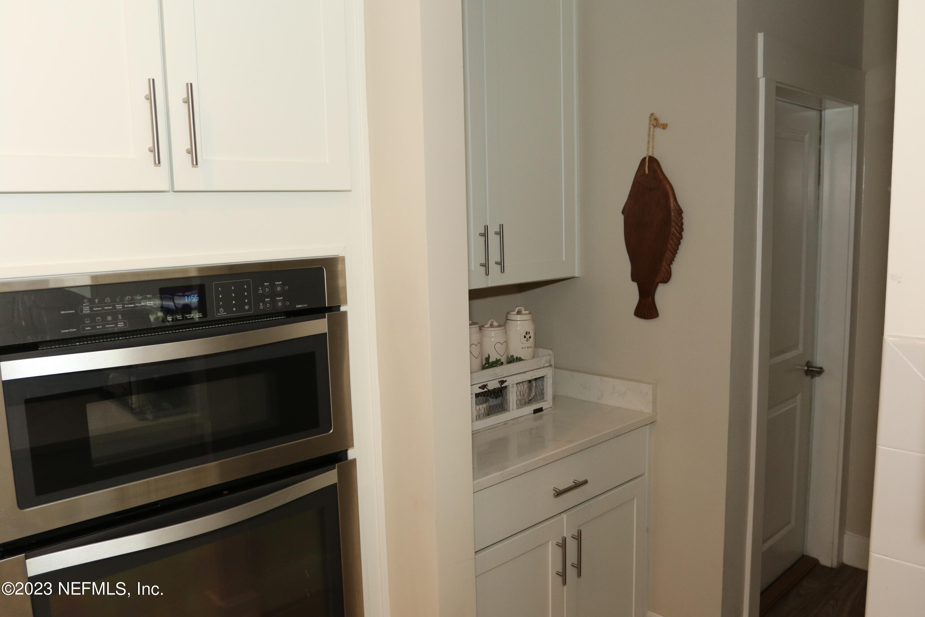 3836 Collins Road Jacksonville, FL 32244 - Photo 25 of 40 a kitchen with cabinets and appliances
