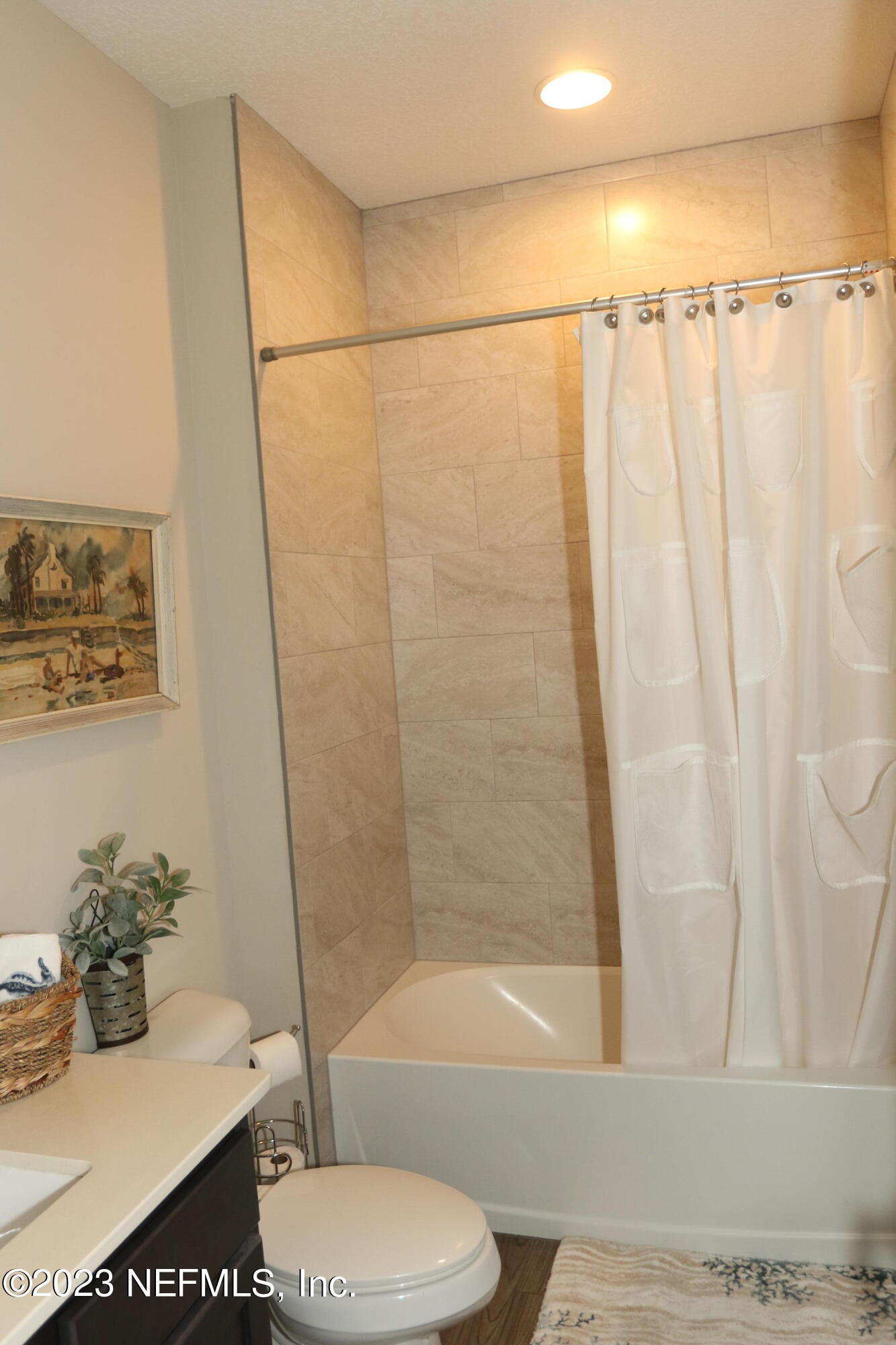 3836 Collins Road Jacksonville, FL 32244 - Photo 29 of 40 a bathroom with a sink toilet and shower