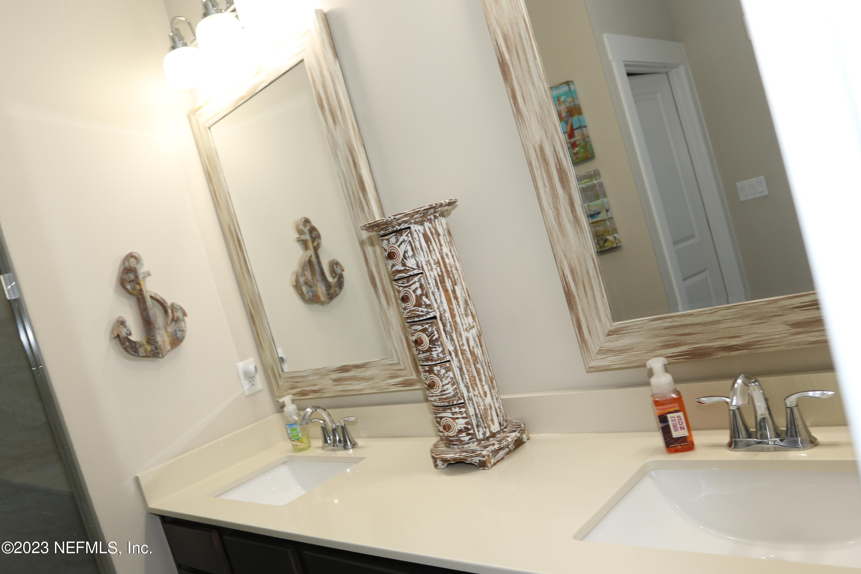 3836 Collins Road Jacksonville, FL 32244 - Photo 30 of 40 a bathroom with a sink and a mirror