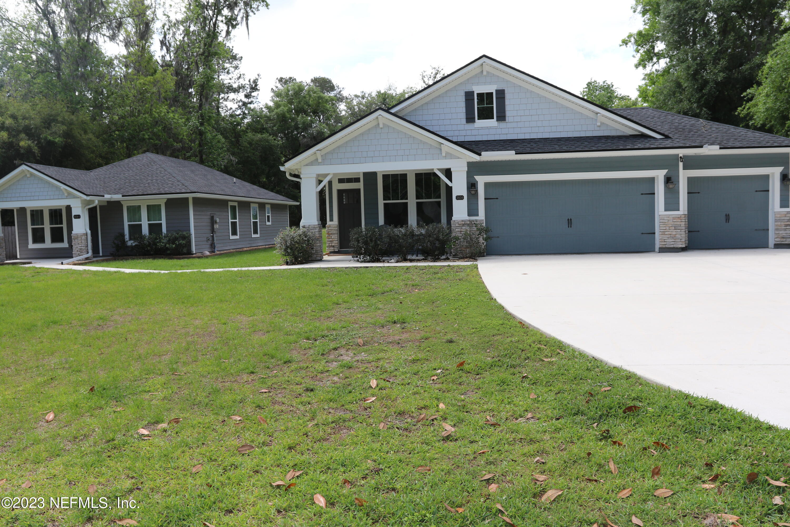 3836 Collins Road Jacksonville, FL 32244 - Photo 3 of 40 a front view of a house with a garden