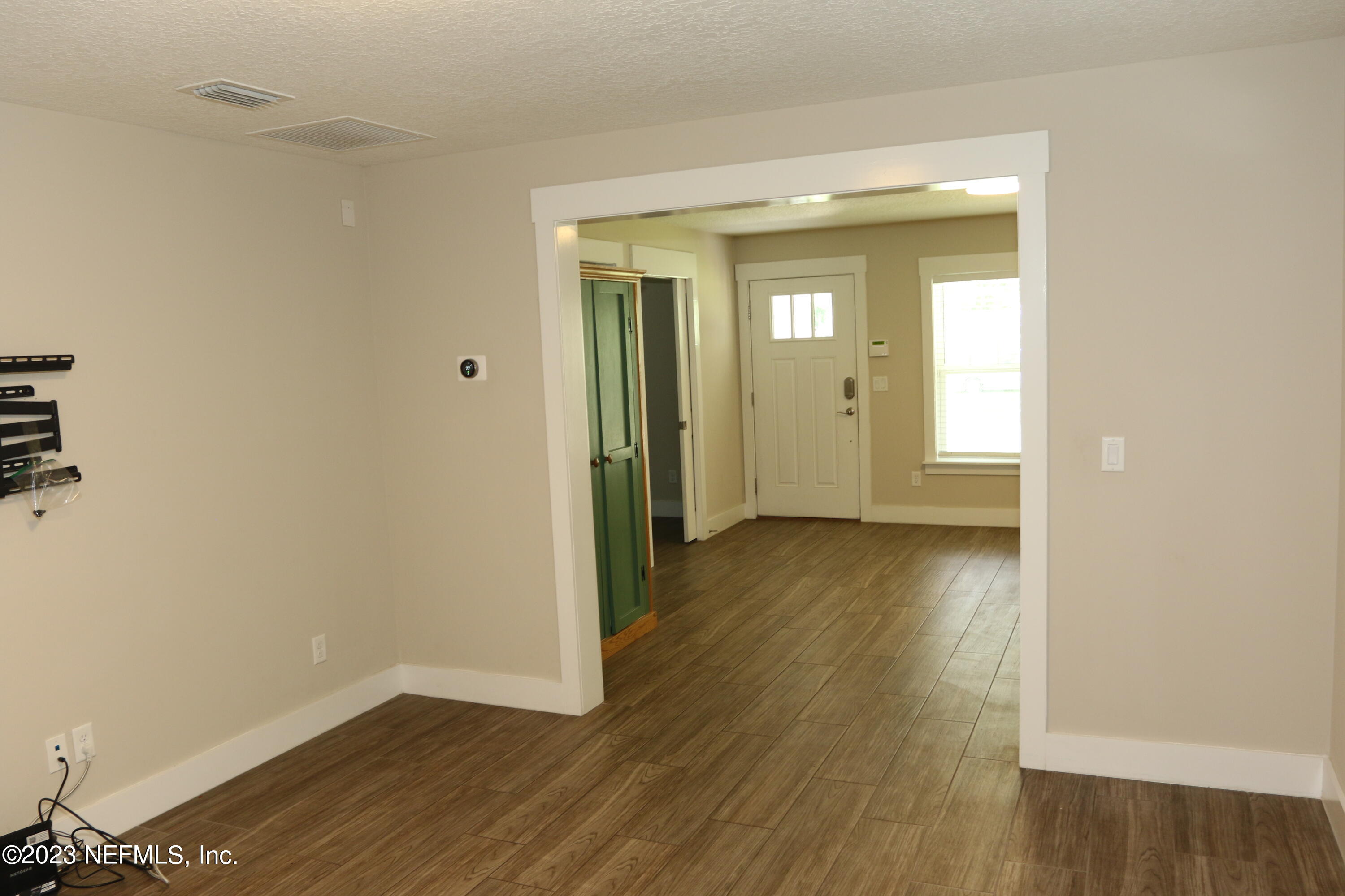3836 Collins Road Jacksonville, FL 32244 - Photo 34 of 40 a view of a hallway with wooden floor