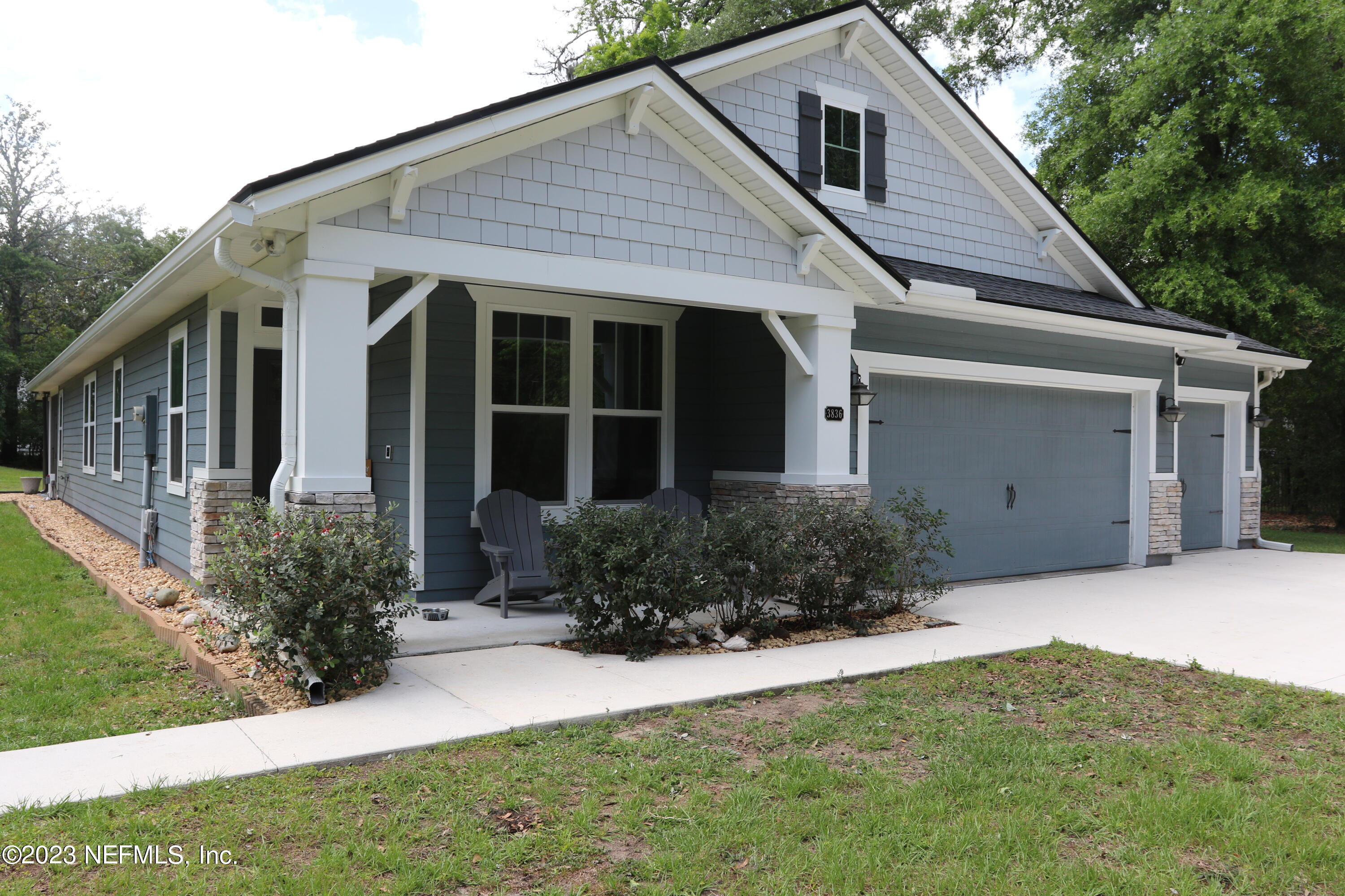 3836 Collins Road Jacksonville, FL 32244 - Photo 7 of 40 a front view of a house with a yard