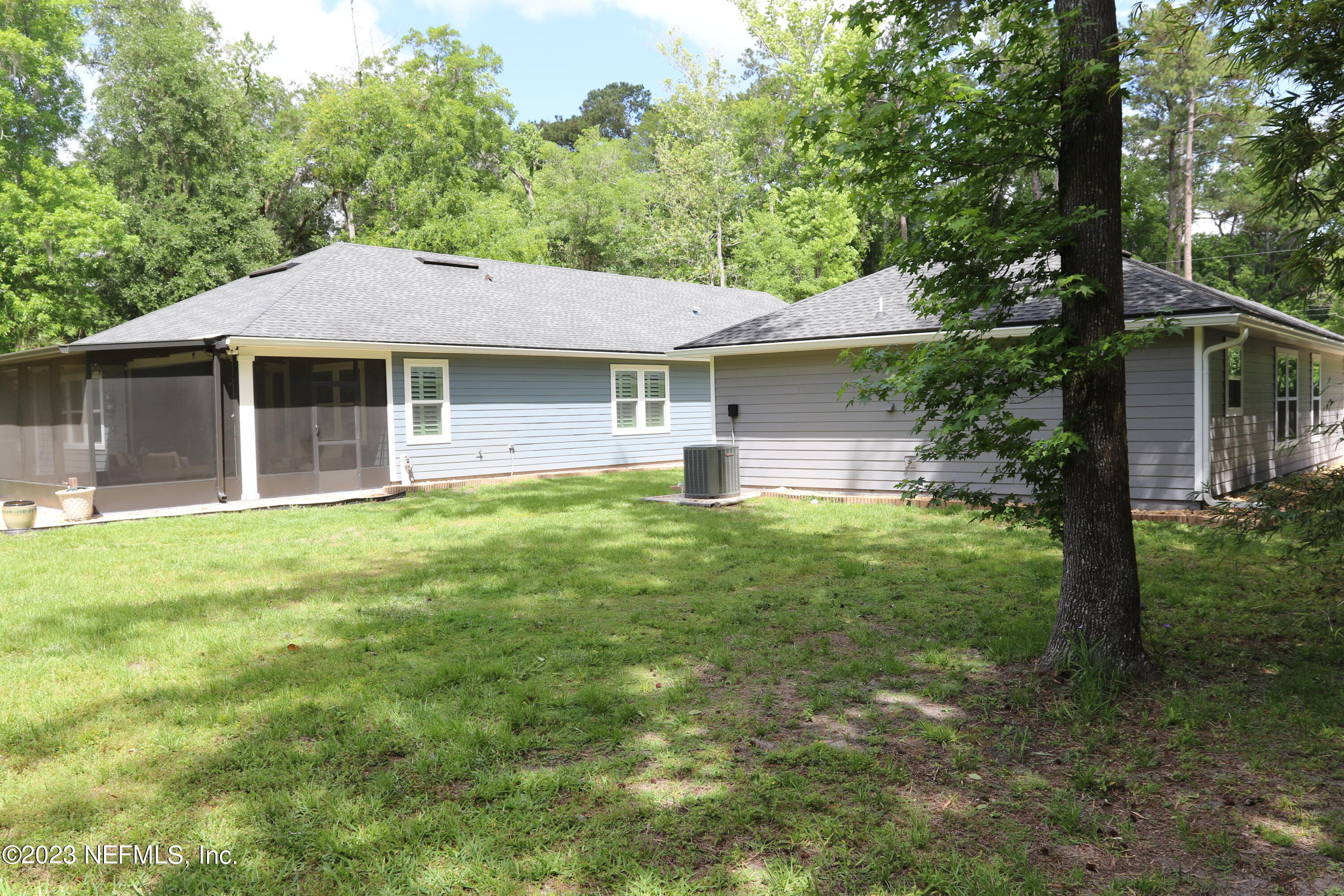 3836 Collins Road Jacksonville, FL 32244 - Photo 8 of 40 a front view of a house with a garden