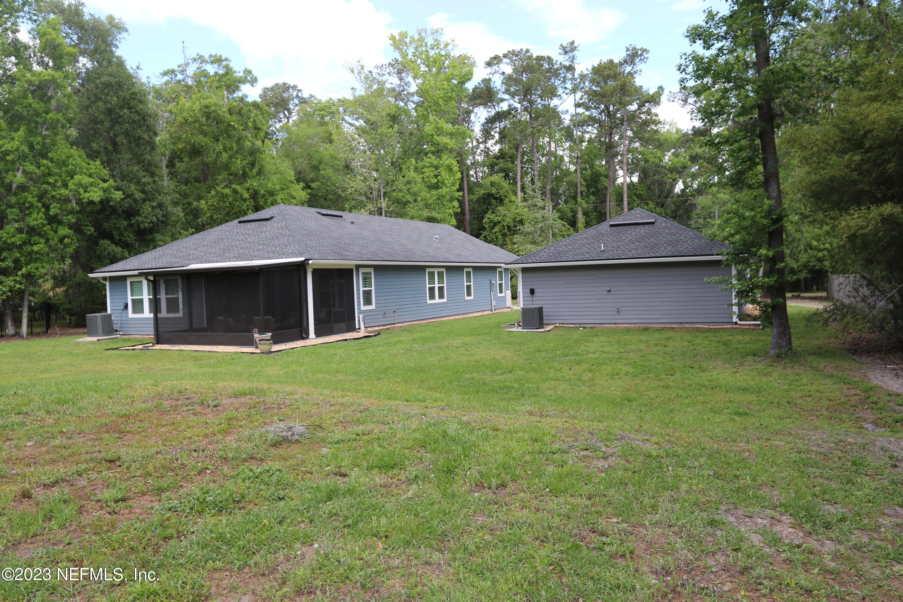 3836 Collins Road Jacksonville, FL 32244 - Photo 9 of 40 a front view of a house with a garden