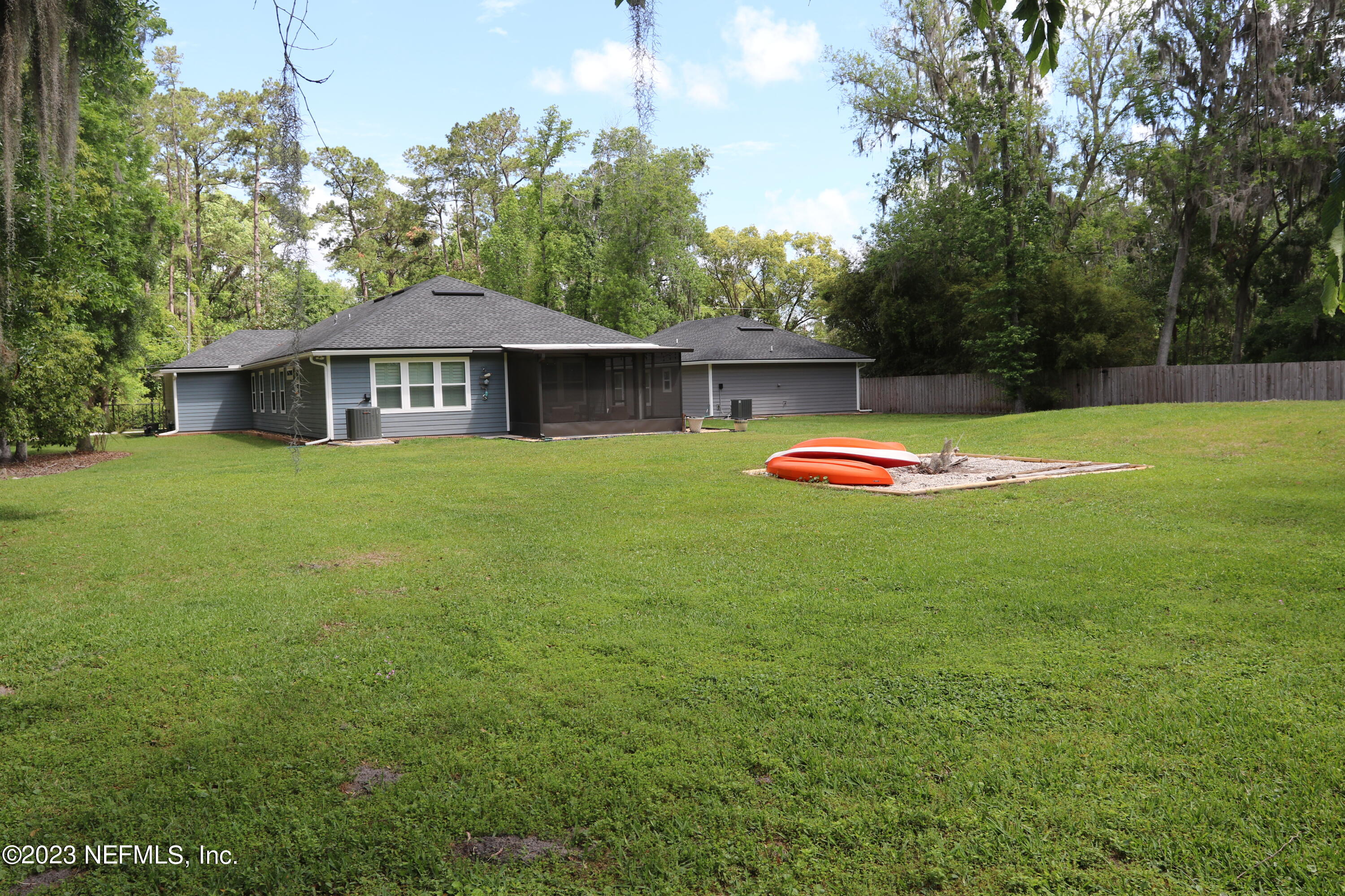 3836 Collins Road Jacksonville, FL 32244 - Photo 10 of 40 a view of a house with a yard