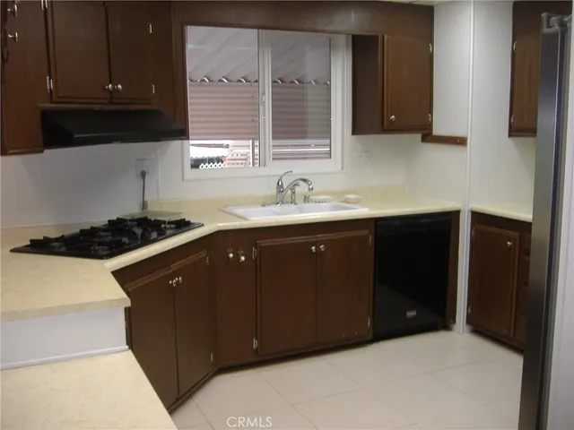 a kitchen with a sink and a stove