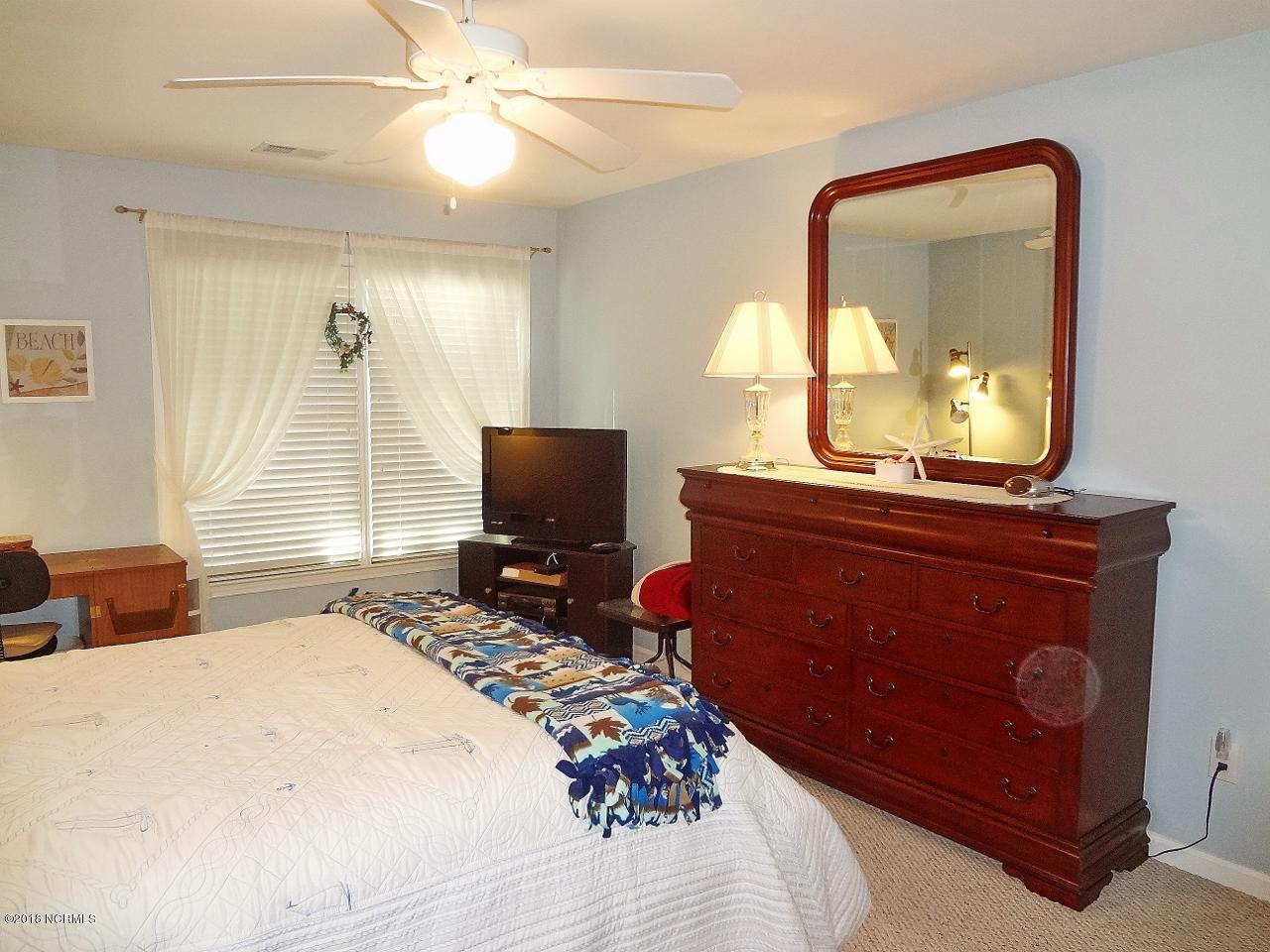 119 Rice Mill Circle, Unit 1 Sunset Beach, NC 28468 - Photo 18 of 37 Master Bedroom