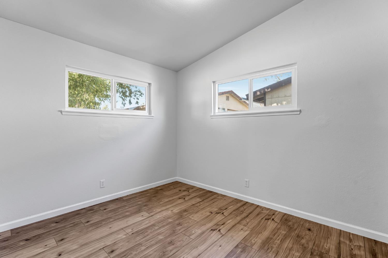 27208 Saunders Road Madera, CA 93637 - Photo 19 of 27 a view of empty room with wooden floor