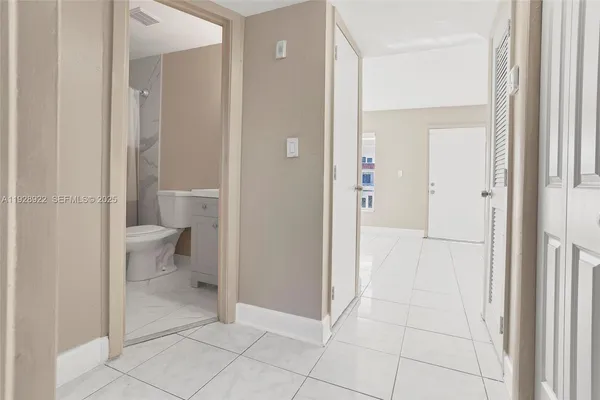 a bathroom view of a toilet and a sink