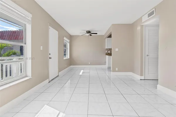 a view of an empty room with a window