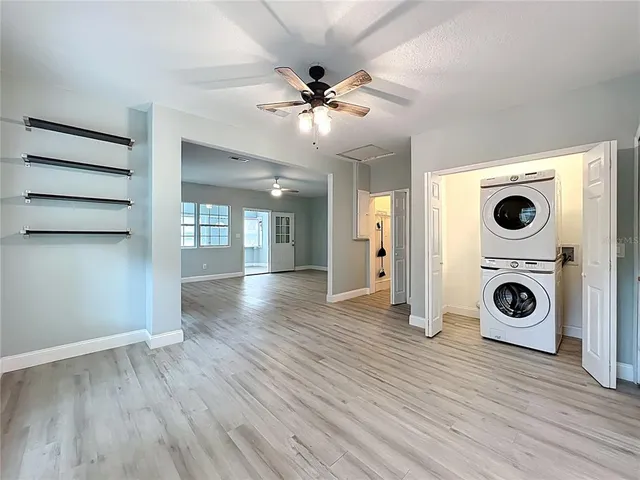 a kitchen with stainless steel appliances granite countertop a sink stove and microwave