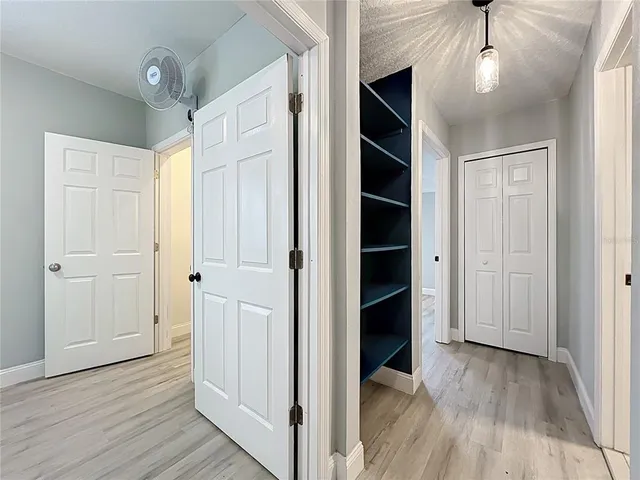 a view of a room with racks on the wall