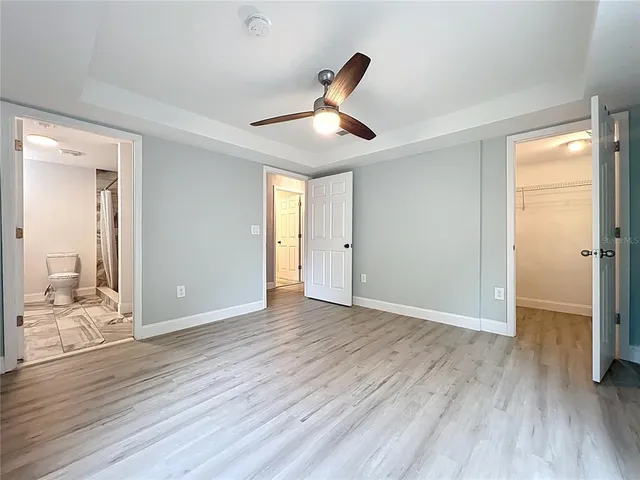 a view of a kitchen with a sink and a window