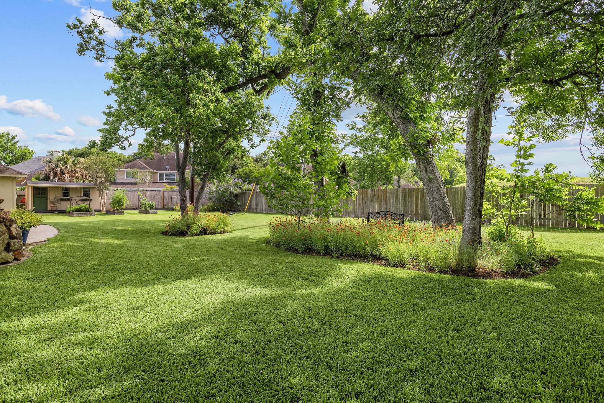 9603 Randon Lane Missouri City, TX 77459 - Photo 45 of 50 The yard provides an abundance of shade, beautiful plants and access to the space behind the house making that an extension of the back yard. Great for walking dogs or hiking and biking.