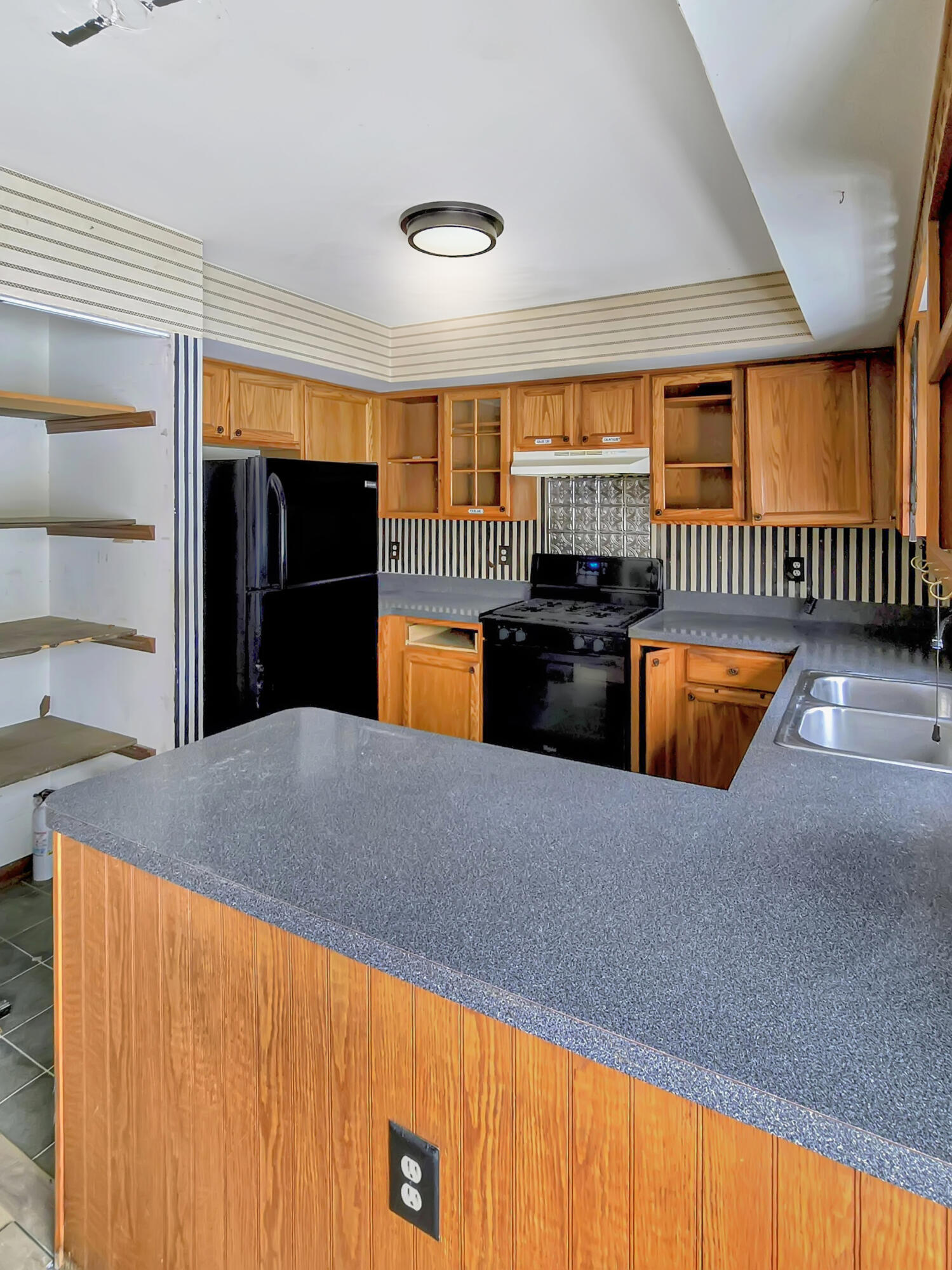 1538 Lake Street Hobart, IN 46342 - Photo 2 of 13 a kitchen with a sink and large window