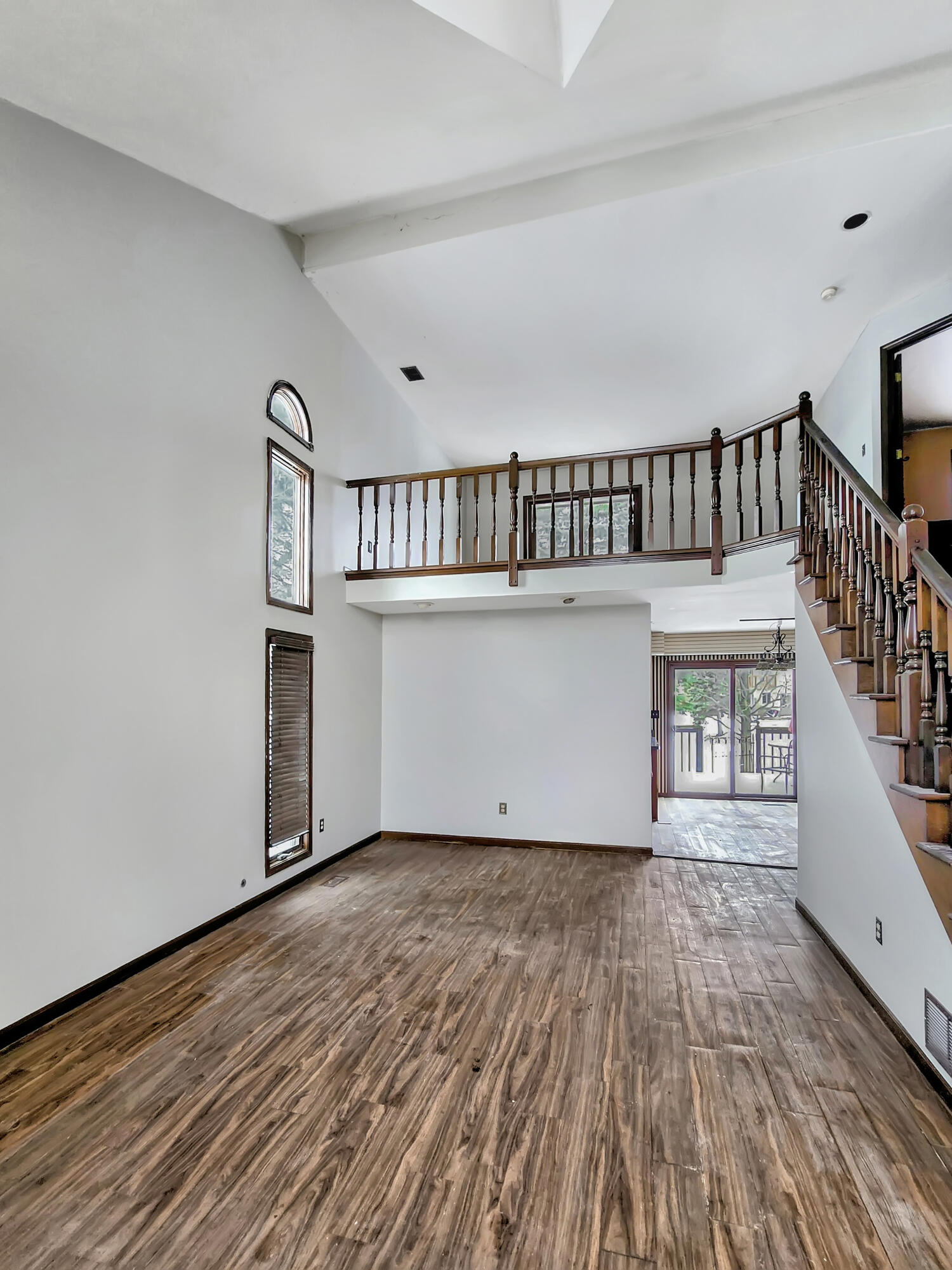 1538 Lake Street Hobart, IN 46342 - Photo 5 of 13 a view of a hallway with wooden floor and staircase