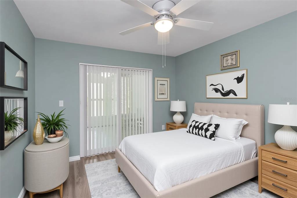 6520 Thicket Trail New Port Richey, FL 34653 - Photo 19 of 43 a bedroom with a large bed and a window