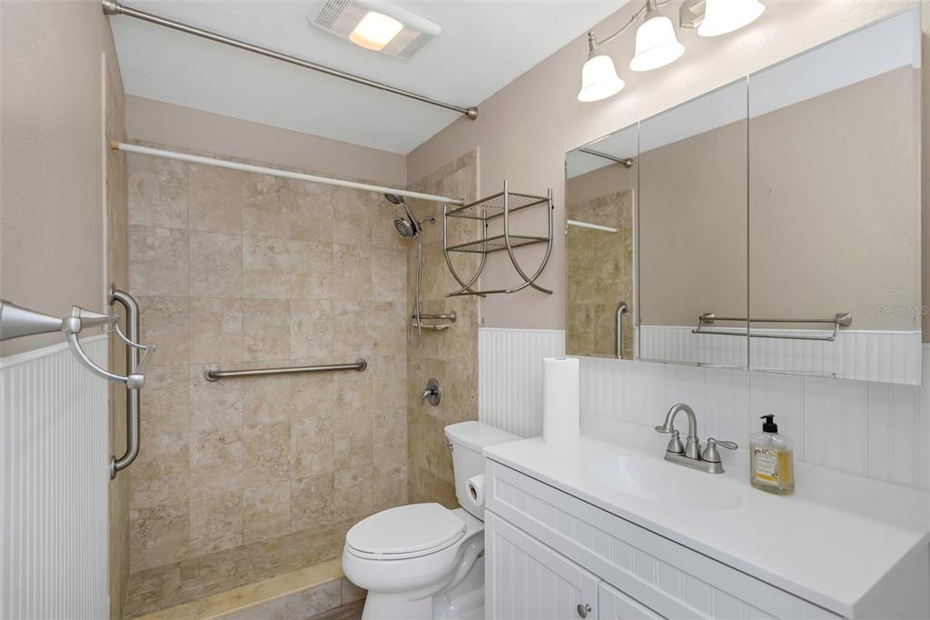 6520 Thicket Trail New Port Richey, FL 34653 - Photo 22 of 43 a bathroom with a sink a toilet and shower