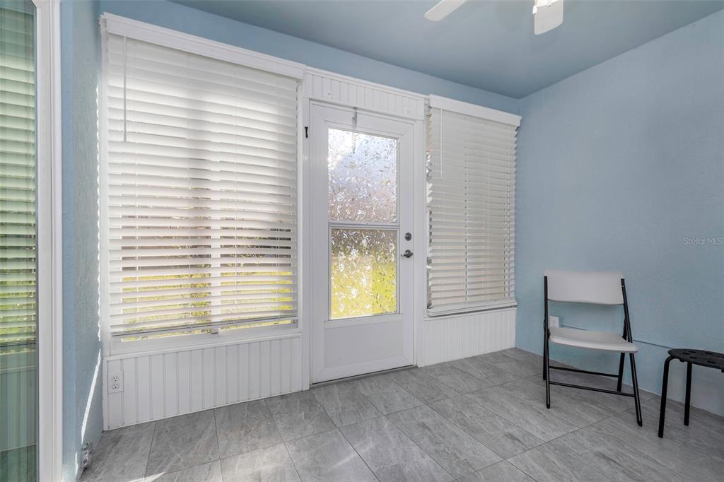 6520 Thicket Trail New Port Richey, FL 34653 - Photo 23 of 43 a view of an empty room with a window and wooden floor
