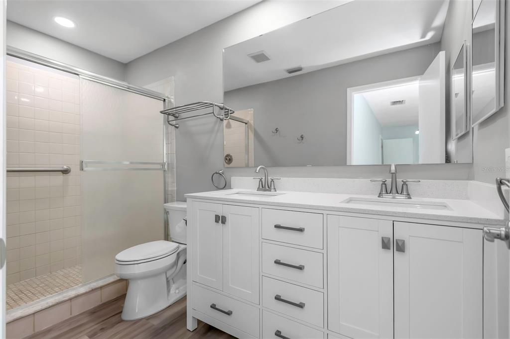 6520 Thicket Trail New Port Richey, FL 34653 - Photo 30 of 43 a bathroom with a sink toilet and shower