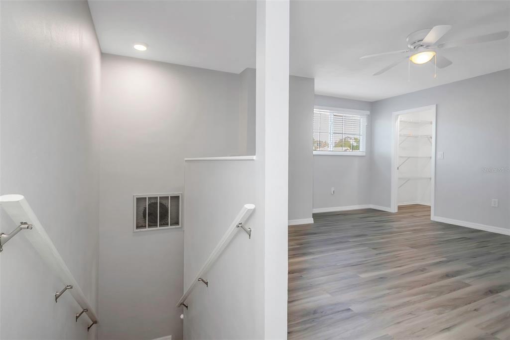 6520 Thicket Trail New Port Richey, FL 34653 - Photo 32 of 43 wooden floor in an empty room with a window